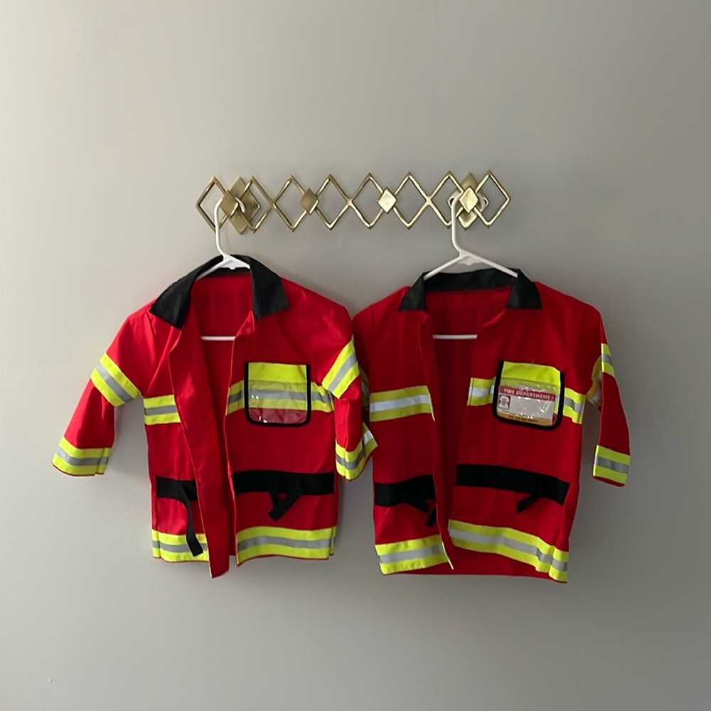 2x matching Melissa & Doug Fire Chief jackets. Lightly worn/good condition.